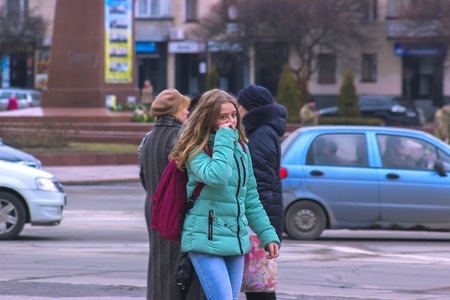 Zhytomyr, Ukraine - SEPTEMBER 15, 2015: Girl walks through People protesting against government against tax growthのeditorial素材