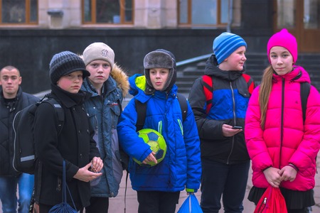 Zhytomyr, Ukraine - SEPTEMBER 15, 2015: Kids looks on People protesting against government against tax growthのeditorial素材