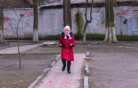 Zhytomyr, Ukraine - September 03, 2015: Young kids return home from school at Mala Berdychivska streetのeditorial素材