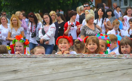 Zhytomyr, Ukraine - September 05, 2015: laughing small kids on the street backgroundのeditorial素材