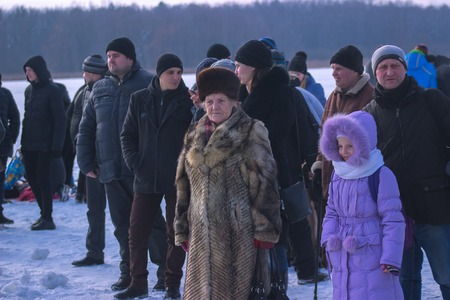 Zhytomyr, Ukraine - January 19, 2016: People celebrating epiphany at winter waterのeditorial素材
