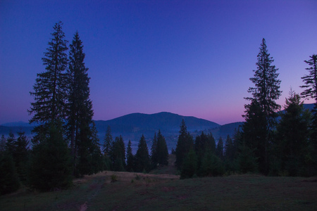 sunrise blue purple sky over mountainsの写真素材