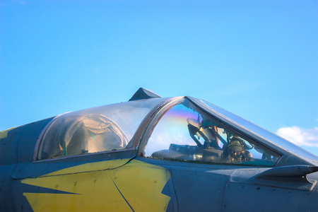 Airplane view on cockpit fuselage at sunset in the airport.