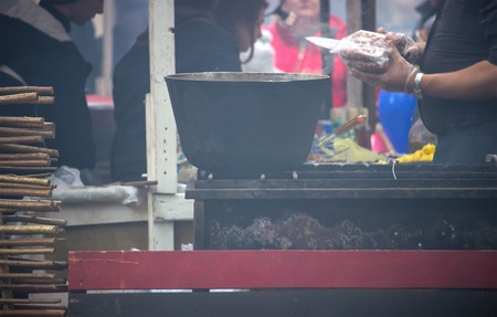 background of fire inside metal brazier at air festivalの写真素材
