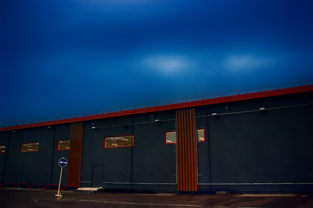 View of modern building with dark mist on the mystic dark city and street sign that shows the wayの写真素材