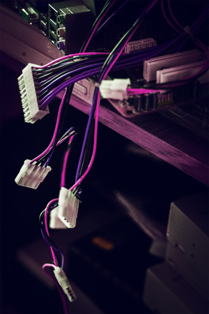 Old computer system unit with spiderweb and dust inside at purple backgroundの写真素材