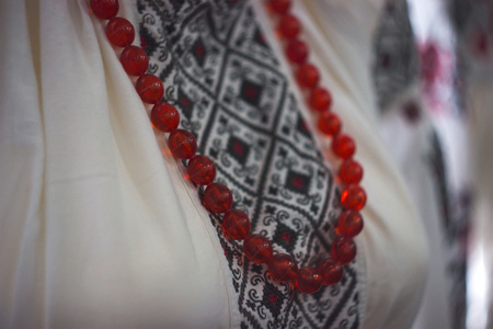 Close up of necklace at white shirt backgroundの写真素材