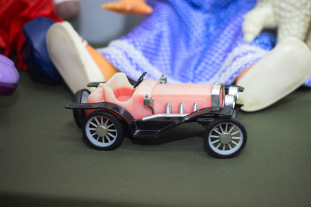 Red racing car on the toy backgroundの写真素材