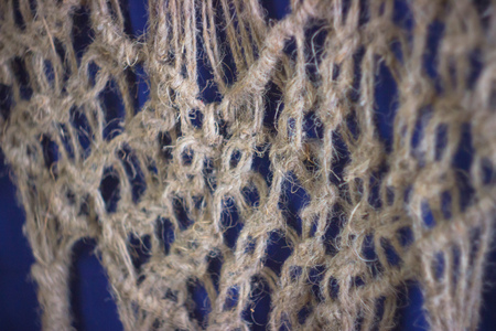 woven netting with lace on a blue background