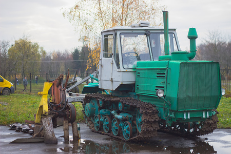 old painted tractor on large metal caterpillars