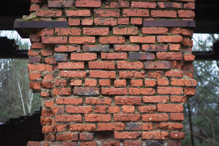 Destroyed brick wall, red texture, building backgroundの写真素材