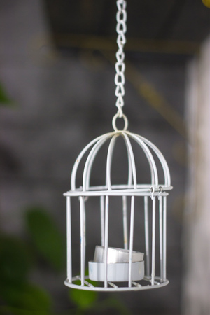 Candlestick with candle, cage style, Valentine's Day decor. On the dark interior background.の写真素材