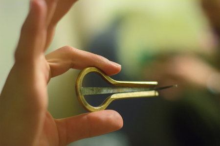 ethnic musical instruments jew's harp in handsの写真素材