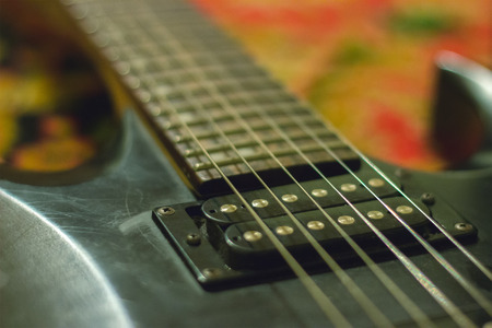 rusty Guitar with single coil pickups at interiorの写真素材