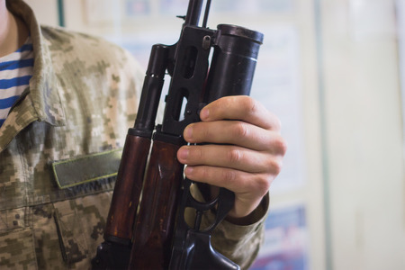 sub machine gun on the table master restorer in the interior gunsmith.の写真素材