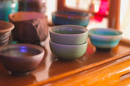 Antique tea bowls stack on desk backgroundの写真素材