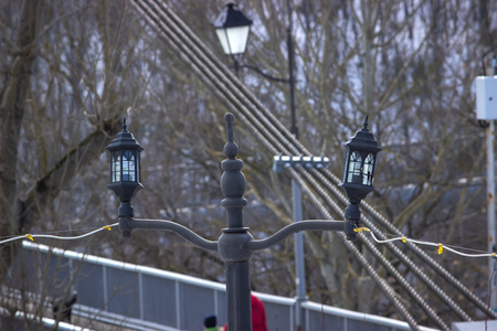 Row of illuminated lanterns in the evening bridge
