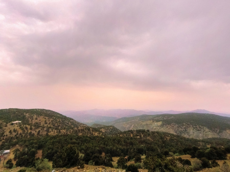 Colorful autumn sunrise in the mountains with moonの写真素材