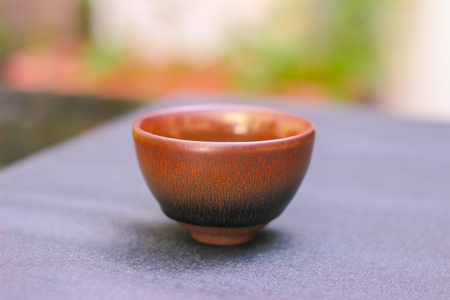 Antique tea bowls stack on desk backgroundの写真素材