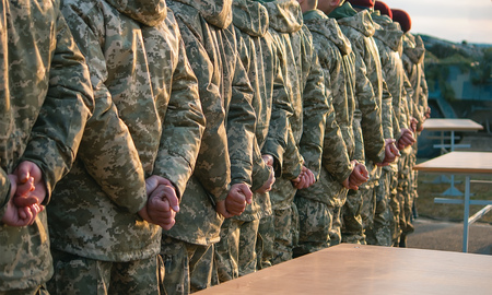 Army parade, military uniform soldier row march, presentment of red hatsの写真素材
