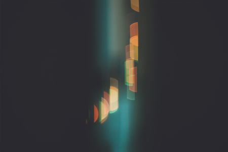 bokeh of christmas garland blurred lights background with red and blue colorsの写真素材