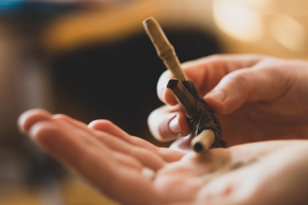 Rapee ceremony. Healing herbs and dust preparing to snuff by tepi bamboo handmade pipeの写真素材