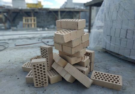 disassemble gray concrete bricks. scattered stone pavement bricks texture.