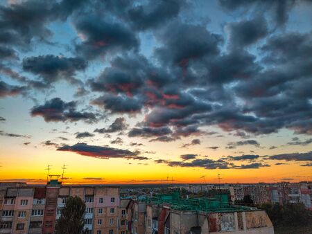 rooftop building panels with wires and satellites at evening
