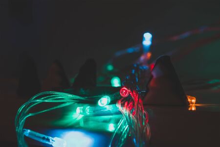 christmas garland blurred lights background with red and blue colorsの写真素材