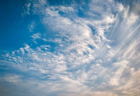 cloudscape with white altocumulus clouds in the evening