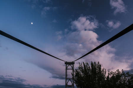 Zhytomyr bridge at sunset against a pink and purple sky.の写真素材