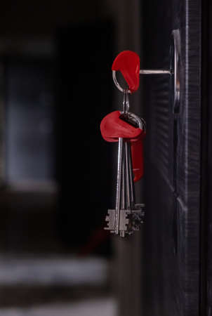 apartment key in the door from unfinished house.の写真素材