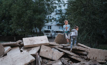 Zhytomyr, Ukraine - September 28, 2020: Children running at concrete structures.のeditorial素材