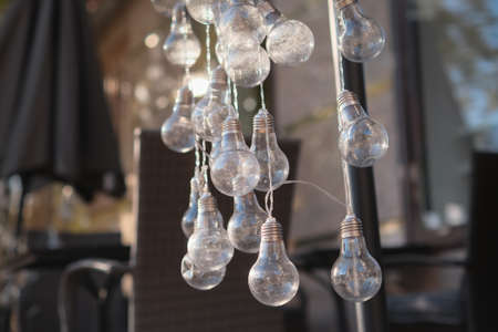 many bright bulbs shine in a dark room