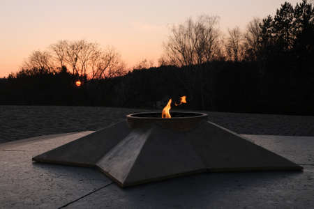 memorial, eternal flame, flames of fire at evening.の写真素材