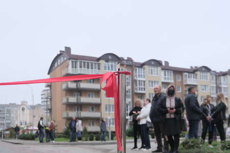 Zhytomyr, Ukraine - September 30, 2020: red ribbon at the festival dedicated to building opening, outdoor.のeditorial素材