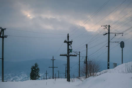 Electric poles and lines during winter season. After The Snow Storm View.の写真素材