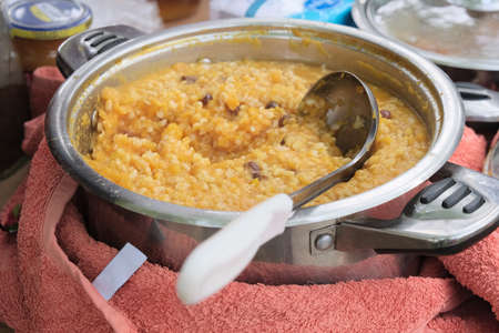 Corn porridge with pumpkin in iron plate.の写真素材