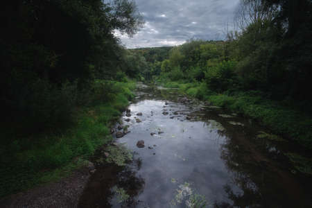 Mountain river in the forest at autumnの写真素材