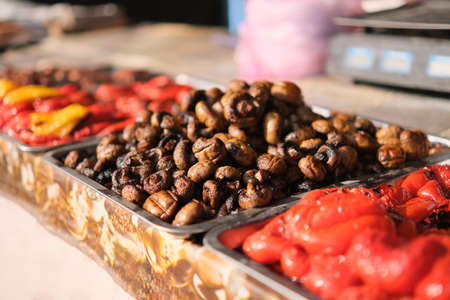 Fried mushrooms on a coal at food market on summer festival.の写真素材