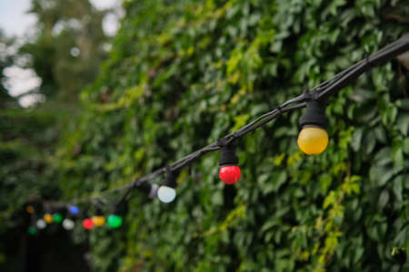 decoration of string lights hanging on a line in small town.の写真素材