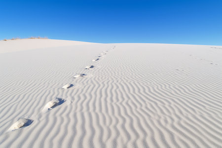Sand dunes rise and fall, creating a mesmerizing landscape of curves and patterns in the desert. Generative AI.の素材