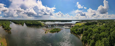A 180 degree aerial panoramic view of a large dam on the Catawba river in South Carolina with Lake...