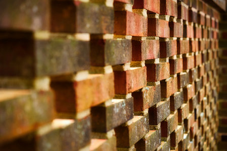 Old brick wall pattern texture background, vintage color tone and selective focus