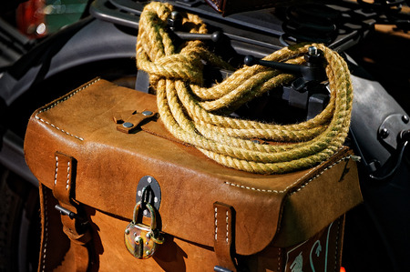 Travel leathern vintage motorcycle saddlebag with ropeの写真素材