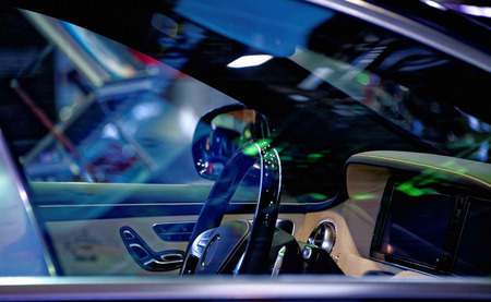 A fragment of the car interior. View through glass from the passenger seat.の写真素材