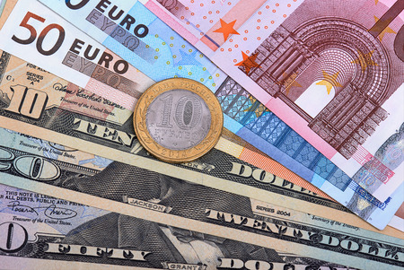 Fanned out banknotes of euros, dollars and Russian coin. Closeup.の写真素材