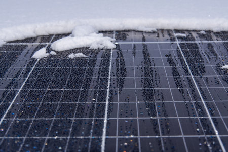 Solar panel park covered with snow after big snowstormの写真素材