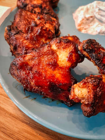 Spicy marinated grilled chicken wingsの写真素材
