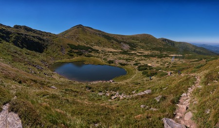 Carpathian mountains landscape, panorama view from the height, Nesamovyte lake under hillの写真素材